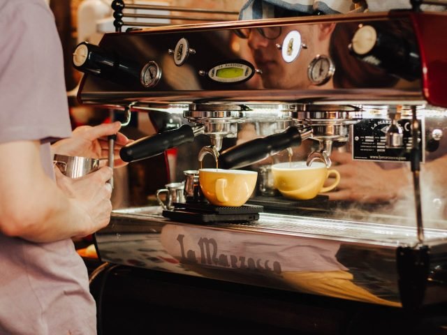 Inside a Brewtopia café, at the counter where our baristas craft coffee